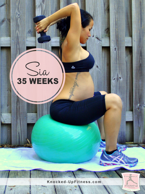 picture of pregnant woman sitting on an exercise ball with weights over her head