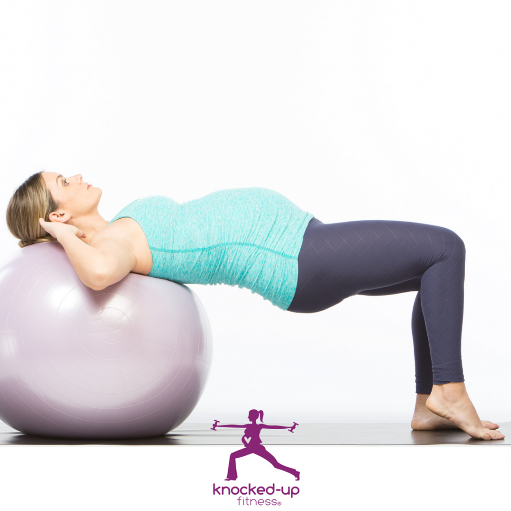 image of woman laying on an exercise ball to relieve pregnancy back pain